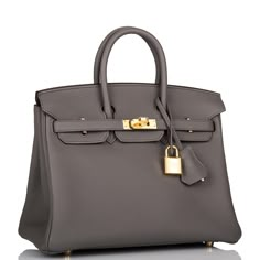 This Birkin is in Etain togo leather with gold hardware and has tonal stitching, two straps with front toggle closure, clochette with lock and two keys and double rolled handles.   The interior is lined with Etain chevre and has one zip pocket with an Hermes engraved zipper pull and an open pocket on the opposite side.   Collection: ZOrigin: FranceCondition: Pristine; new or never  (plastic on hardware)Accompanied by: Hermes box, Hermes dustbag, clochette, lock, two keys, clochette dustbag, rainhat, carebook, ribbon and felt Measurements: 10" width x 7.5" height x 4.75" depth; 2.75" handle drop Hermes Birkin 25, Hermes Box, Togo Leather, Birkin 25, Hermes Bags, Hermes Birkin, New Bag, Birkin Bag, Brunei