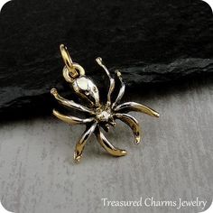 This Spider Charm comes with a gold jump-ring as pictured. Please note that photo is not to scale and may appear larger to show detail. Refer to exact measurements below.Additional attachments (lobster clasp, large-hole bead, necklace chains) are available from the charm-attachments drop-down menu.  For a visual example of the different attachments and what each one is best suited for, scroll through the photos until you see the example photo or visit https://etsy.me/2BY7DAW for detailed informa Unique Gold Halloween Jewelry, Unique Gold Jewelry For Halloween, Handmade Gold Novelty Jewelry, Collectible Gold Jewelry For Halloween, Pandora Beads, Halloween Charms, Anatomical Heart, Large Hole Beads, Pandora Bracelet