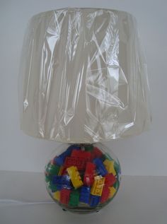 a lamp that is made out of legos and plastic wrapper on top of it