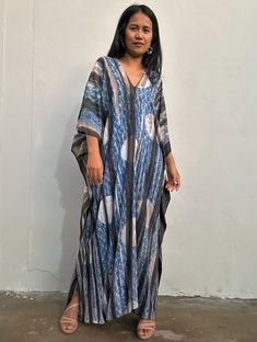 MEASUREMENTS:  * One Size Fits  * Best for US size: Large to 2XL * Arms      22 inches round * Bust / Waist / Hips Circumference 64 inches * V-Neck      * Length    52  inches  * Material   100% Rayon, Natural Indigo dye M O D E L: * Size US 4  * Height 5 feet 4 inches or 163 cm. With 4 inch High Heel. Long Tie Dye Kaftan Free Size, Tie Dye Long Kaftan Free Size, Casual Kaftan With Natural Dye For Festivals, Long Tie Dye Free Size Kaftan, Flowy Tie Dye Kaftan Tunic, Flowy Tie-dye Tunic Kaftan, Tie Dye Flowy Tunic Kaftan, Tie Dye Flowy Maxi Kaftan, Casual Festival Kaftan With Natural Dye