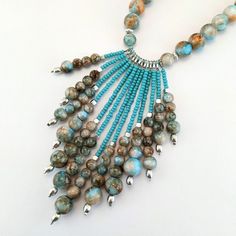 ❤Before completing your purchase, please, read carefully about delivery times for your country and keep in mind that delivery delays may happen due to the pandemic situation and the consequent decrease in the number of flights worldwide. So pretty and stylish jewelry! A delicate long boho necklace beaded with high-quality glass beads, crystals beads, metal beads, and blue tassel embroidered with crystals. It's perfect to compose any look, basic or classic, you can wear it any time. ❤IMPORTANT TO Turquoise Bohemian Tassel Necklace, Bohemian Tassel Necklace With Beaded Chain, Bohemian Turquoise Necklace With Dangling Beads, Turquoise Beaded Tassel Necklace With Round Beads, Adjustable Turquoise Tassel Necklace With Round Beads, Turquoise Beaded Tassel Necklace, Turquoise Beaded Tassel Necklace Gift, Handmade Turquoise Tassel Necklace Bohemian Style, Turquoise Beaded Long Necklace With Dangling Beads