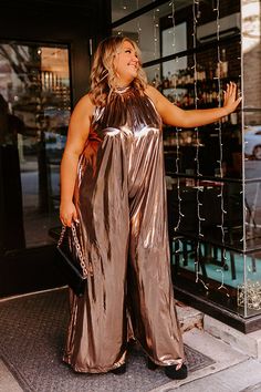 - Make a bold style statement with this glam jumpsuit! - Sleek, metallic, gold colored material - A built-in lining that ends thigh length - A mock neckline with back tie closure with a keyhole detail - Low back zip closure - A sleeveless cut - An ultra-relaxed silhouette that ends in wide floor length hemlines Glam Jumpsuit, Metallic Jumpsuit, Metallic Jumpsuits, Amazing Views, Bold Style, Mock Neckline, Style Statement, Women Clothing Boutique, Bold Fashion