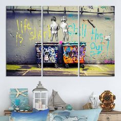 three canvases with graffiti on the wall in front of a bed and nightstands