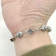 Our Dice Fleur Bracelet comes in one universal size at 7.5" length. Made of 100% 316L Stainless Steel. Which will not rust, tarnish or turn green, and corrosion resistant. PRODUCT DESCRIPTION- 316L Stainless Steel, corrosion resistant, will not turn green- Strong and durable- Safe in water, shower safe. Sizing- 7.5" LengthAll orders come with one quantity unless otherwise specified in the quantity selection. Have a question? Email info@availjewelry.com and we will get back to you within one busi Adjustable Durable Silver Bracelet, Silver Metal Bracelet With Custom Hardware, Adjustable Chain Bracelet As Gift, Adjustable Durable Chain Bracelet As Gift, Durable Adjustable Chain Bracelet As A Gift, Durable Adjustable Chain Bracelet For Gift, Silver Stainless Steel Jewelry With Custom Hardware, Adjustable Hypoallergenic Sterling Silver Bracelet, Adjustable Engraved Metal Chain Bracelet