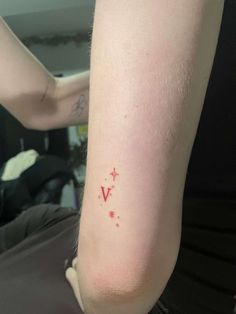 a person with a small tattoo on their arm