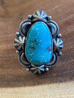 Navajo Kingman Turquoise Sterling Silver Ring Size 8. It measures 1 1/2 inches long and just over 1 inch wide. Signed by the artist and stamped sterling. Thank you for checking out my store, if you have any questions please contact me!! SKU:32090081886293_99207de* Southwestern Style Engraved Turquoise Ring As Gift, Engraved Southwestern Style Turquoise Ring For Gift, Southwestern Stamped Turquoise Ring, Southwestern Stamped Turquoise Ring Gift, Southwestern Style Stamped Turquoise Ring As Gift, Western Style Stamped Turquoise Ring Gift, Collectible Western Style Turquoise Ring Stamped 925, Unique Stamped Turquoise Ring, Artisan Engraved Turquoise Ring Collectible