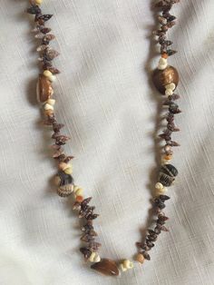 "Shell surfer necklace, with a variety of sized shells, very diverse shapes and tones. Measures about 39\" in length. Also please take a look at my storefront at: https://www.etsy.com/shop/FabFinds42?ref=seller-platform-mcnav I have a wide selection of one-of-a-kind items, from clothing and toys to home decor and gift items, and I add new things almost every day." Granola Girl Necklace, 70s Necklace, Hawaii Necklace, Necklace Shell, Orange Bracelet, Beach Necklace, Surfer Necklace, Retro Clock, Beach Necklaces