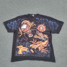 Vtg 90s Dragons And Clouds Aop Single Stitch Size Xlarge. Good Condition, No Pinholes, No Rips Or Tears, No Stains. Single Stitch Hem On Sleeves As Well As The Bottom Hem; On The Rock Eagle Tag. Ships Next Day Via Usps First Class! Size: Xlarge Measurements: Armpit To Armpit: 24 Inches Bottom Hem To Top Of Collar: 27 Inches Shoulders (Across): 21 Inches Sleeve Length: 9 Inches 90s Vintage Print Black T-shirt, 90s Style Printed T-shirt For Streetwear, Casual Streetwear Shirt With Vintage Print, Casual Shirt With Vintage Print For Streetwear, Retro Shirt With All Over Print For Streetwear, Retro All Over Print Shirt For Streetwear, 90s Style Black Shirt With Graphic Print, Black Casual T-shirt With Vintage Print, Vintage Black Printed T-shirt