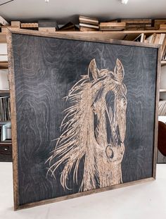 a painting of a horse is on display in a room with bookshelves and other items