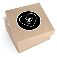 a cardboard box with a black and white heart sticker on it