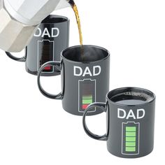 three coffee mugs with the words dad on them being poured into each other's cups