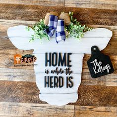 a sign that says home is where the herd is