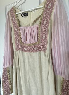 True vintage Gunne Sax dress with rare, black label in a Renaissance style. This was bought from a closing theatre company so it has been pre-loved. I believe it may be from 1969. There are some flaws - pilling and tiny holes that have been sewn. Please review pictures before purchasing. Zipper in back and on the sleeves.  Unsure of the size, but I would say around an XS. 60s Medieval Revival Fashion, 1970s Medieval Revival, Vintage Dresses For Costume Party With Historical Design, Vintage Empire Waist Costume Dress, 1970s Style Fitted Vintage Dress For Vintage Events, Vintage Long Sleeve Dress For Costume Party, Vintage Dress With Historical Design For Costume, Fitted Vintage Dress With Historical Design, Vintage Dresses With Historical Design For Party