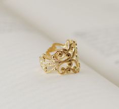 High quality gold plated over brass Victorian style filigree ring. Classy and elegant. The ring has beautiful and intricate details. It is adjustable, can be easily adjusted to fit most fingers. Ring is also available in silver plated finish in my shop (5th picture). Thank you for stopping by. Please contact me if you have any questions or need a different quantity :) My shop: http://www.etsy.com/shop/LeChaim About LeChaim: http://www.etsy.com/shop/LeChaim/about A0610-RING40 Elegant Gold Filigree Open Ring, Ornate Gold Filigree Ring With Intricate Design, Gold Ornate Filigree Ring With Intricate Design, Elegant Gold-plated Filigree Ring, Elegant Gold Plated Filigree Ring, Gold Filigree Open Ring Gift, Adjustable Gold Filigree Rings, Gold Open Filigree Ring For Wedding, Gold Filigree Open Ring For Gifts