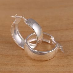 This is solid 925 sterling silver plain huggie hoop earrings. A pair of two highly polished earrings. 925 stamped . Approx. measures: External Diameter : 25mm                  Width : 8.0mm Approx. weight : 6.5 grams   Presented in gift box.     Thank you for looking! Silver Hoop Earrings With Shiny Finish As Gift, Gift Silver Hoop Earrings With Shiny Finish, Silver Hoop Earrings With Shiny Finish For Gift, Silver Sterling Huggie Earrings With Shiny Finish, Classic Hoop Earrings Stamped 925 For Anniversary, Classic 925 Stamped Hoop Earrings For Anniversary, Classic White Gold Hoop Earrings Stamped 925, Silver Huggie Earrings For Gift With Shiny Finish, Classic Silver Hoop Earrings Stamped 925