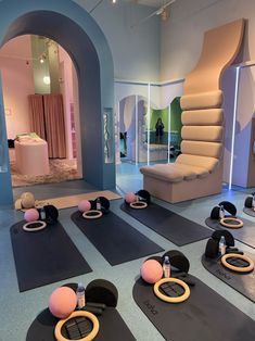 yoga mats are lined up on the floor