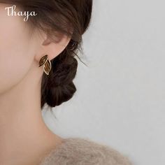 Leaf Studs embody the elegance of minimalist jewelry. Their delicate lines and subtle curves create a natural and organic look, inspired by the beauty of leaves. These earrings symbolize growth, renewal, and connection to nature, reminding us of the simplicity and beauty of the world around us.   - Brand: Thaya  - Material: Copper plated with 14k gold + fine polishing + oil dripping + 925 silver needles  -Size: Approximately 2.2cm in length, 1.4cm in width  - Weight: 4.62g  - Shape: Petals, leav Gold Cleaner, 24 Hour Fast, Connection To Nature, Beauty Of The World, Winter Leaves, Silver Cleaner, Fancy Jewelry, Delicate Jewelry, Copper Plated