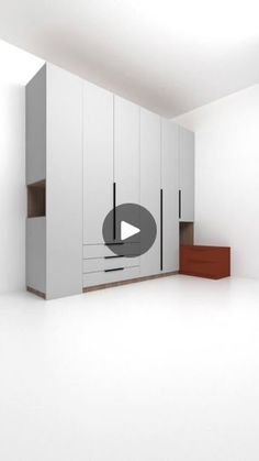 an empty room with white walls and cabinets