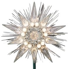 a silver and white star shaped light fixture