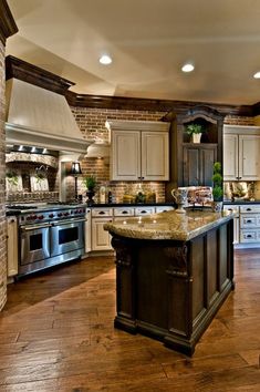 a large kitchen with an island in the middle