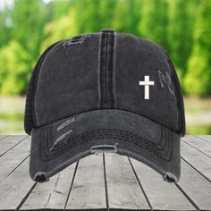 All hats are one size fit the most.  Show your faith in style with this distressed trucker-style cap, featuring a minimalist embroidered white cross. Whether you're attending church, heading to a casual outing, or simply going about your day, this cap offers a subtle and stylish way to express your beliefs. The distressed design provides a vintage, worn-in feel, perfect for laid-back, everyday wear. Perfect for: Faith-based events, casual wear, and gifting This cap is a great way to share your f Outdoor Distressed Visor Hat, Distressed Snapback Dad Hat For Outdoor, Distressed Trucker Hat With Curved Brim, Outdoor Distressed Trucker Hat, Distressed Snapback Hat, Distressed Trucker Hat One Size Fits Most, Christian Hats, Distressed Cap, Jesus Cross