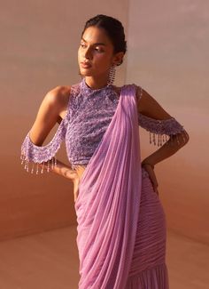 Capture attention with this lilac ombre leather printed net pre-draped sari, accompanied by a stylish halter blouse adorned with sequins beadwork. A striking ensemble for those who love to stand out. Pre Draped Saree, Ombre Saree, Cotton Sarees Handloom, Draped Saree, Net Embroidery, Leather Embroidery, Halter Blouse, Drape Saree, Sleeves Blouse