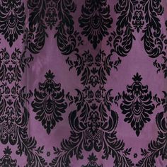 a purple and black fabric with an ornate design