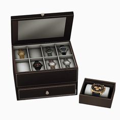 an open watch box with several watches in it