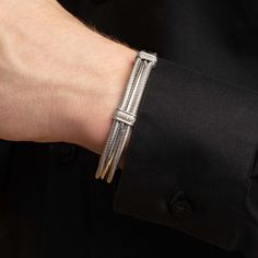 Our Maschio Men's Cuff Bracelets are masculine but luxurious with fine details. Choose from various options, each with different features. This bangle is larger in size and is standard length to fit most men's wrists. Made in Italy. Category: BraceletMetal: Sterling SilverStones: Choice of Black or White Diamonds (both 0.05 ct)Closure: Open CuffCollection: Men's Jewelry Fits average men's wrist sizes of about 8 inches. Luxury Adjustable Sterling Silver Bracelet With Polished Finish, Minimalist Formal Cuff Bracelet, Adjustable Luxury Sterling Silver Bracelet, Luxury Adjustable Cuff Bangle, Luxury Adjustable Sterling Silver Bracelet, Luxury Adjustable Jubilee Cuff Bracelet, Luxury Polished Cuff Bracelets, Elegant Polished Sterling Silver Cuff Bracelet, Adjustable Luxury Bangle For Formal Occasions