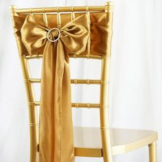 a gold chair with a bow on it