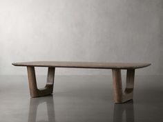 a wooden table sitting on top of a gray floor