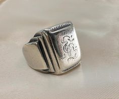 Massive 1920s antique silver German signet ring, with initials 'EL' or 'LE' engraved, the ring is in good antique condition.  Material: 800 silver Weight: 22.5 g US size: 9 (EU 60) Ring With Initials, Signet Rings, Silver Signet Ring, German Silver, Slovenia, Signet Ring, Wedding Shop, Antique Silver, Labour Day