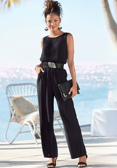 This classic cut, sleeveless jumpsuit takes you from casual to formal with ease. Black Sleeveless Jumpsuit, The Guest List, Bra Fitting Guide, Swim Trends, Jumpsuit Black, Guest List, Work Wear Women, Best Dressed, One Piece Suit