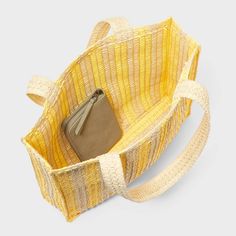 Hold your daily essentials in style with this Stripe Straw Crochet Tote Handbag from A New Day™. This fashionable tote handbag features an unstructured silhouette that's decorated with woven-texture crochet detailing with yellow and light beige stripes. The single main compartment helps keep your cellphone, wallet and more in one spot, while the double handle makes it easy to carry in hand or on your shoulder. Universal Thread™: Found exclusively at Target. Texture Crochet, Crochet Tote, Woven Texture, Tote Handbag, Crochet Details, Daily Essentials, Universal Thread, Light Beige, Tote Handbags