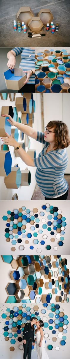 a woman is standing in front of a wall made out of geometric shapes