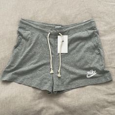 Women’s Slim Fit, Mid Rise Nike Shorts Nike Relaxed Fit Shorts For Summer, Nike Lounge Shorts With Pockets, Nike Shorts With Pockets For Loungewear, Nike Loungewear Shorts With Pockets, Casual Nike Shorts For Summer, Nike Short Leg Bottoms For Summer, Summer Nike Shorts, Nike Leisure Shorts With Pockets, Nike Cotton Shorts For Summer