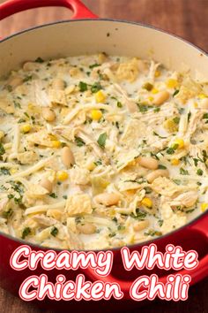 creamy white chicken chili in a red pot on a wooden table with text overlay