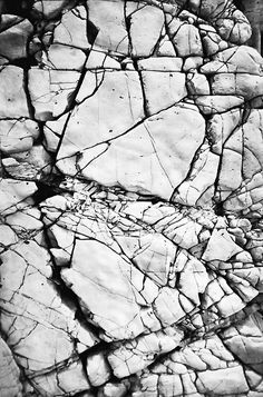 black and white photograph of cracked rocks