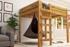 a loft bed with a chair underneath it and a hanging hammock on the bottom