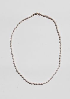 A hand knotted silk with 4mm rice pearl beads and a 14k gold clasp. Measures 16.75" long. Knotted Bead Bracelet, Hand Knotted Pearls, Silk Cord Necklace, Clay Bead Necklace, Hand Knotted Necklace, Silk Necklace, Pearls Necklace, Silk Cord, Knot Necklace