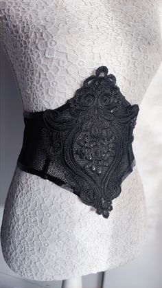 A beautiful design of a classic corset belt,made of black elastic net fabric decorated on the middle with black lace applique.It finally fastens with ribbon Always sent with international tracking number and gift wrapped Gothic Fitted Corset Belt With Corset Back, Gothic Corset Belt With Corset Back, Black Lace Belt, Gothic Black Corset Belt With Belt Included, Black Gothic Corset Belt With Boning, Belt Inspiration, Black Lace Gothic Corset Belt, Black Corset Belt, Black Lace Corset