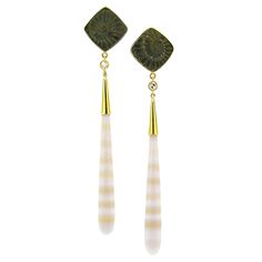 These sophisticated earrings feature fossil imprints of ancient ammonites, which have mineralized into pyrite. The drops are German-carved agate with alternating bands of creamy white and translucent peach. The rich bronze color of the pyrite and the soft tones of the agate are richly enrobed in 18kt gold. The juxtaposition of these two elegant gems elevates these luxurious earrings. -Fossil Ammonite in Pyrite (Germany) -Banded Agate (Brazil) -0.22ct Diamonds -18kt Gold -earrings measure approxi Victorian Drop Earrings, Art Deco Drop Earrings, Engraved Earrings, Platinum Earrings, Orange Agate, Luxury Earrings, Diamond Dangle Earrings, Agate Earrings, Agate Jewelry