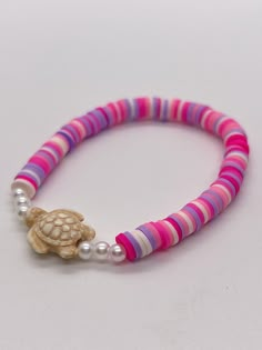 Handmade 7 in. preppy beaded bracelet. Contains light pink, hot pink, white, and purple 6mm clay beads. Also has pearl beads, and a cute turtle bead!! I can custom create any jewelry for you. Just let me know what colors you want, and if you want a word on it or not. I can also make phone charms and rings, and necklaces. Necklaces Handmade Ideas, Clay Bead Bracelet Pink, Pink Hypoallergenic Beaded Bracelets For Beach, Hypoallergenic Pink Beaded Bracelets For Beach, Pink 8mm Beads Jewelry For Beach, Hypoallergenic Pink Friendship Bracelets For Beach, Summer Bracelet Ideas, Clay Beads Ideas, Bracelets Clay Beads