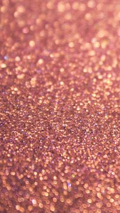 a close up view of pink glitter on a surface that looks like it could be used as a background or wallpaper