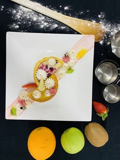 a white plate topped with fruit and pastry