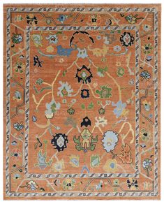 an orange and blue rug with many different designs on the border, in various colors