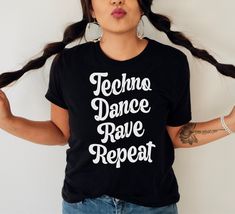 Techno Dance Rave Repeat Shirt, House Music, Festival Shirt, EDM Gift, EDM Shirt, Rave Gift, Rave Shirt, trance tee, griz shirt, trippy tee High quality Bella + Canvas tee. Unisex Tee in relaxed fit - Soft, stylish and lightweight. Most customers feel the shirts fit true to size, however, ladies should size down if you prefer a fitted look or if you have a petite body frame. The shirt is a relaxed /loose fit and will be slightly longer in body length and sleeve length. Please consult size chart within images. All our apparel are SCREEN PRINTED directly onto the garment itself, NO vinyl or heat transfer is used, No bulky feelings here, just soft breathable t-shirts with vibrant Ink colors that will last you wash after wash. **Please note that, due to variations amongst computer monitors, ac House Music Festival, Techno Dance, Rave Shirt, Rave Shirts, Festival Shirt, Festival Shirts, Body Frame, Bella Canvas Tees, House Music