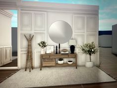 a living room with white walls and wooden furniture in front of a large round mirror