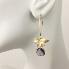 "Purple Amethyst Earrings, Gold Flower Earrings, Orchid Floral Earrings, Flower Dangles, Dangle Drop Earrings, February Birthstone Gift, Wedding Bridal Earrings, Bridesmaid Gift Idea Gold Orchid Amethyst Dangle Earrings These darling earrings consist of a matte gold plated orchid flower connector with a bezel set faceted purple glass teardrop dangling from long gold tone copper ear wires. Available in short and long dangle: Short dangle is 1.25\" from top of ear wire. Long dangle is 2\" from top Delicate Purple Earrings For Wedding, Delicate Purple Wedding Earrings, Purple Pierced Earrings For Wedding, Purple Flower-shaped Jewelry For Weddings, Purple Flower Earrings For Wedding, Purple Flower Wedding Earrings, Wedding Flower Dangle Earrings Pierced, Purple Crystal Earrings For Wedding, Elegant Purple Wedding Earrings