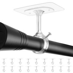 a black and white photo of a wine glass holder on a wall with several hooks attached to it